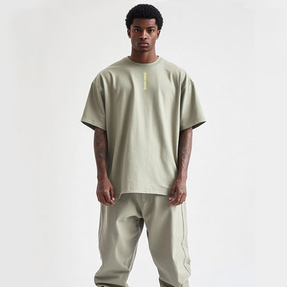 a black model wearing an oversized tee, photo studio with white background